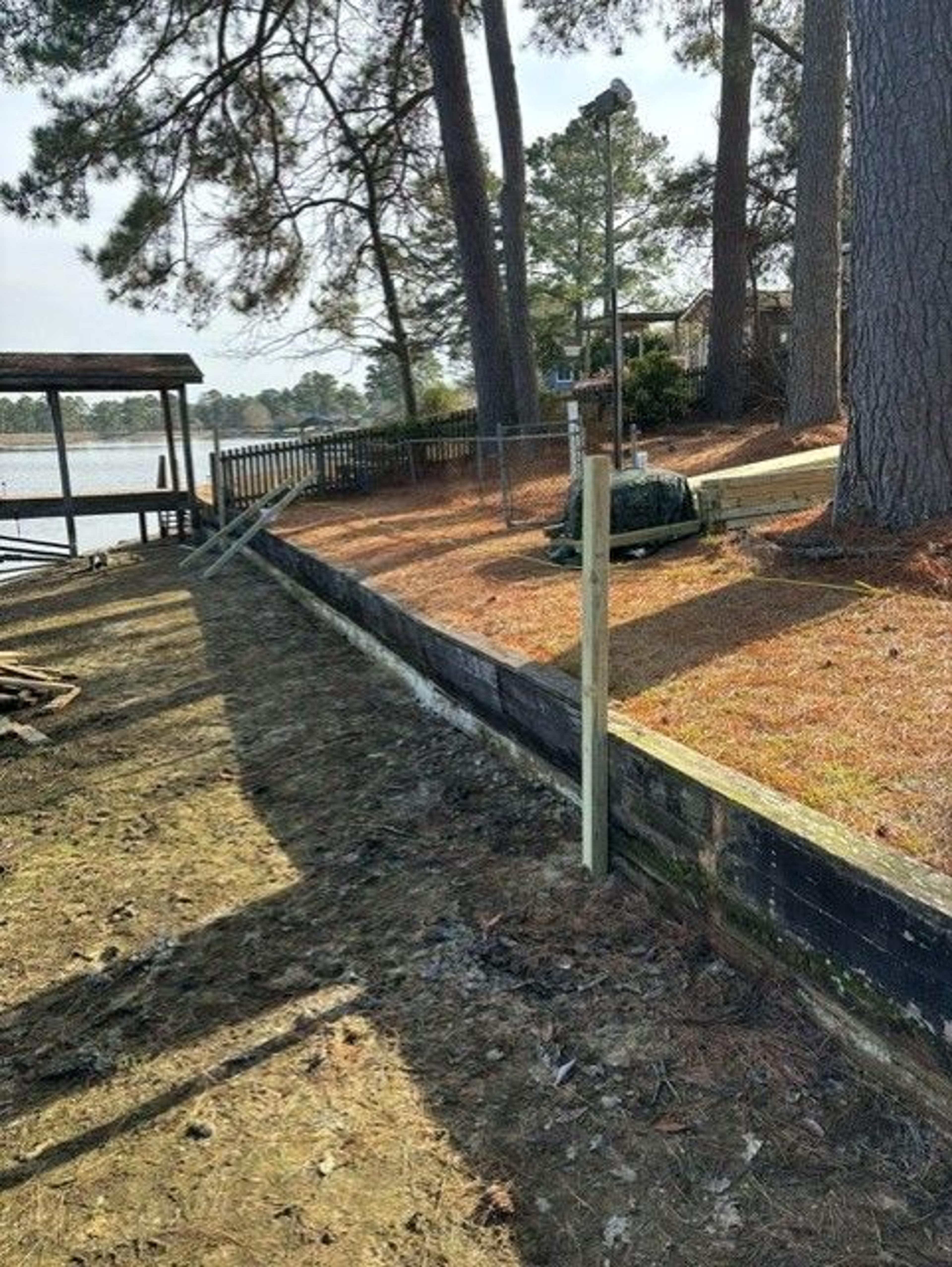 Shoreline Stabilization With Boardwalk And Boat Shelter — before