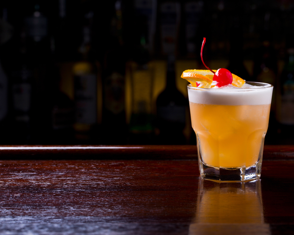 Ameragave Sour glass on wooden table