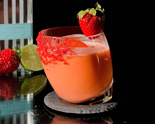 Strawberry Bliss drink with limes and strawberry decor