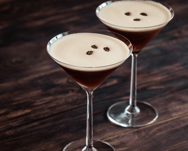 Two Espresso Martini drinks on a table