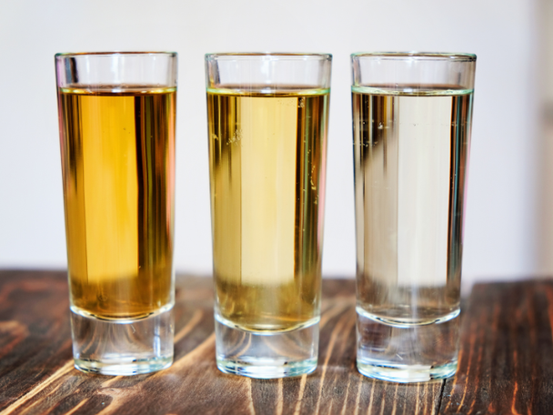 A variety of tequila glasses on a table