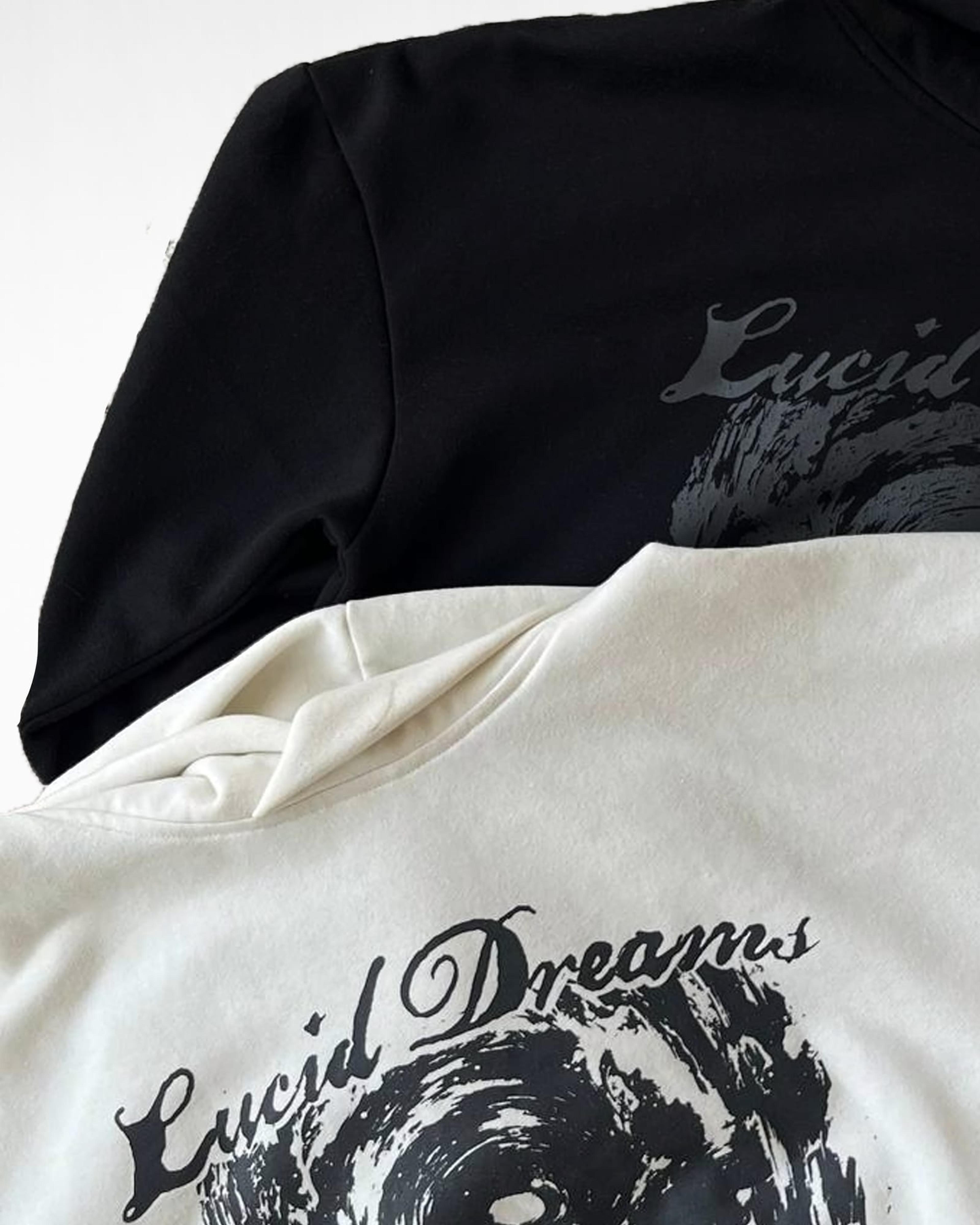 Close-up of the front print on the Black and Cream White hoodies