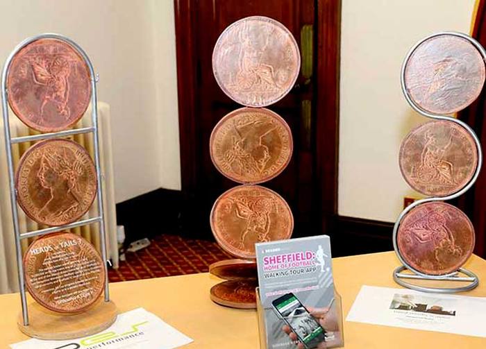 Heads or Tails sculpture