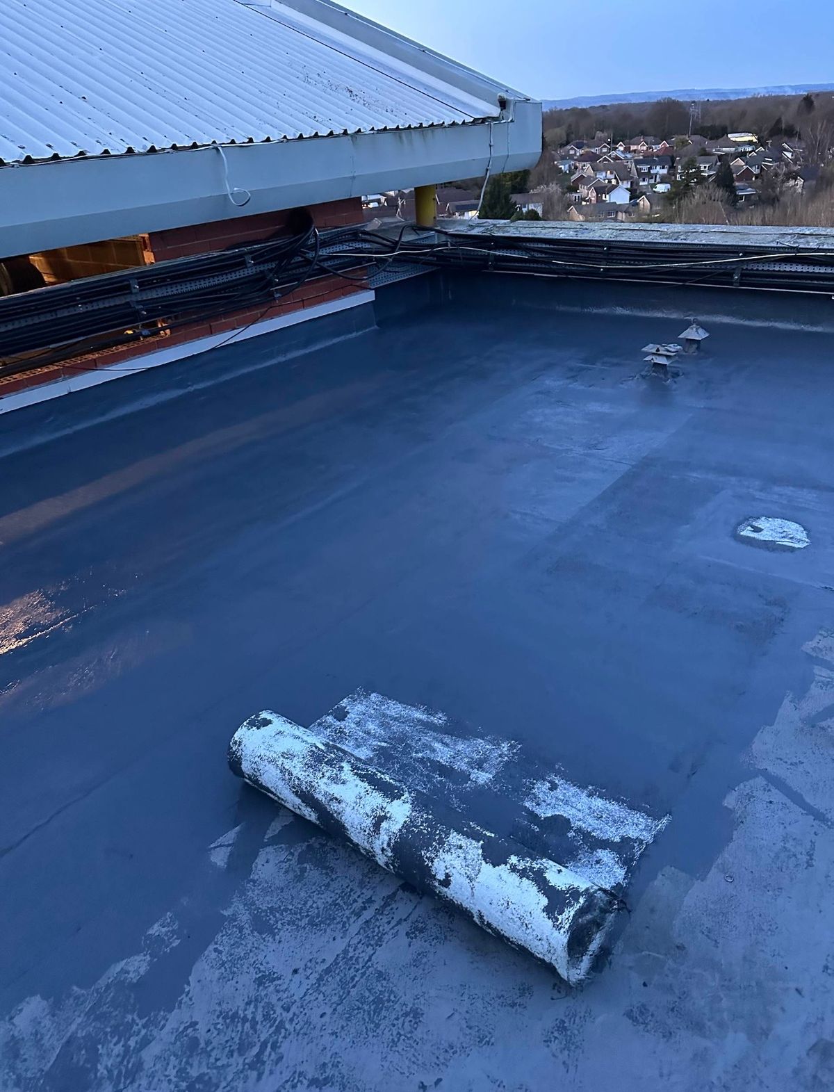 Liquid waterproofing application in progress.