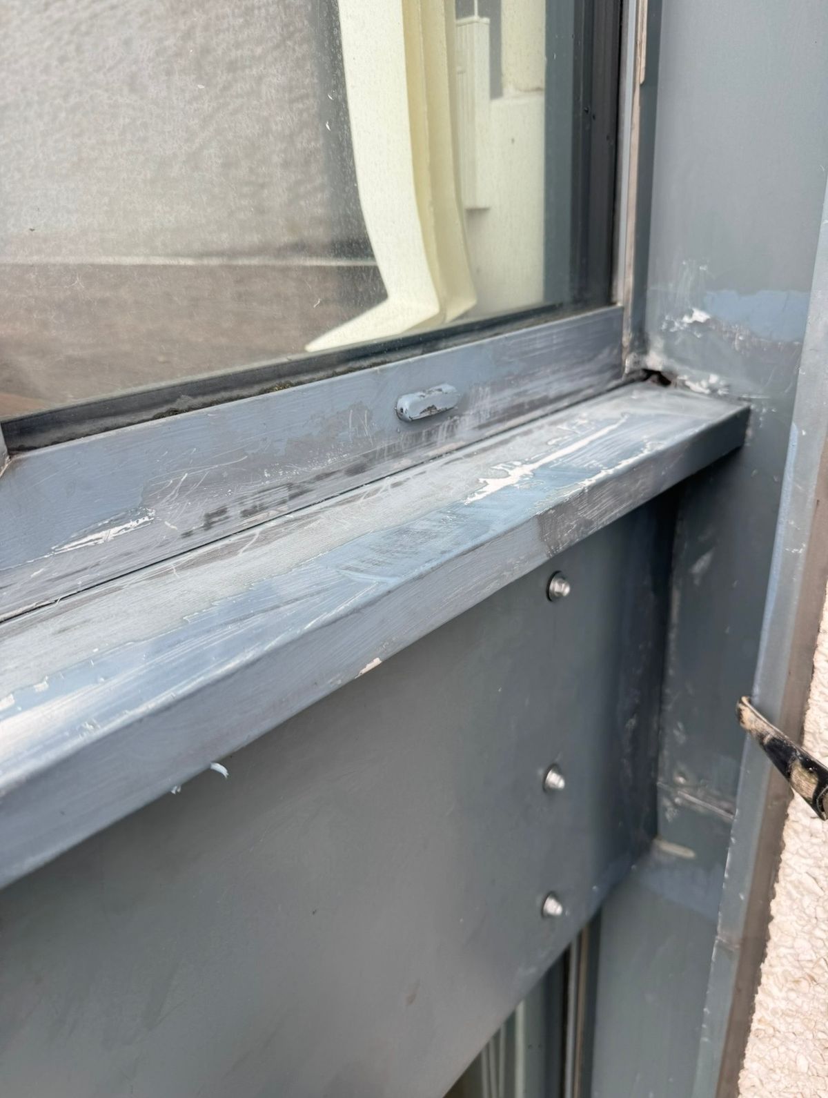 Window junction exposed following removal of the previous repair during investigation of water ingress on a Newcastle high-rise residential building.