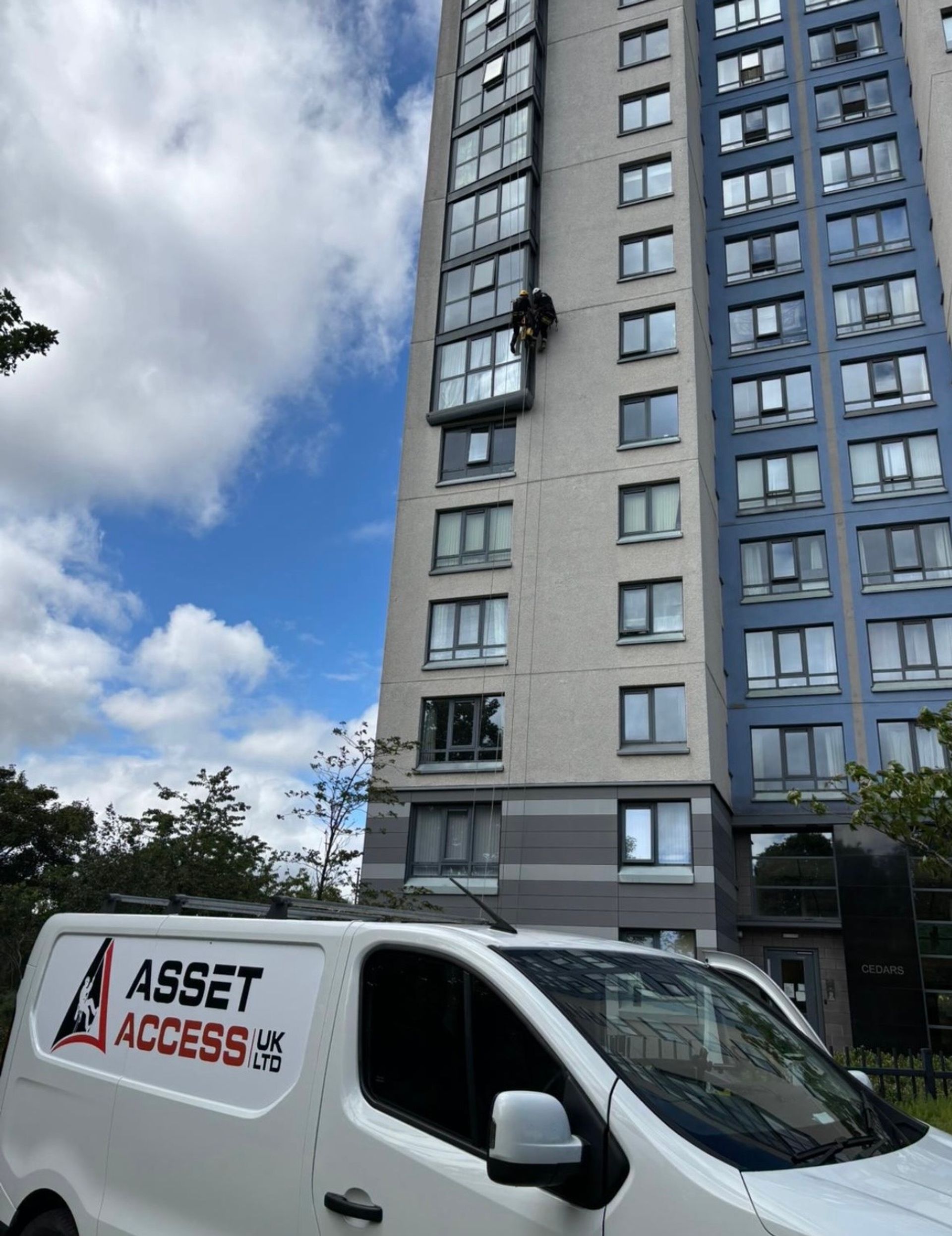 Asset Access UK rope access technician carrying out water leak investigation and repair on a high-rise residential building in Newcastle upon Tyne.