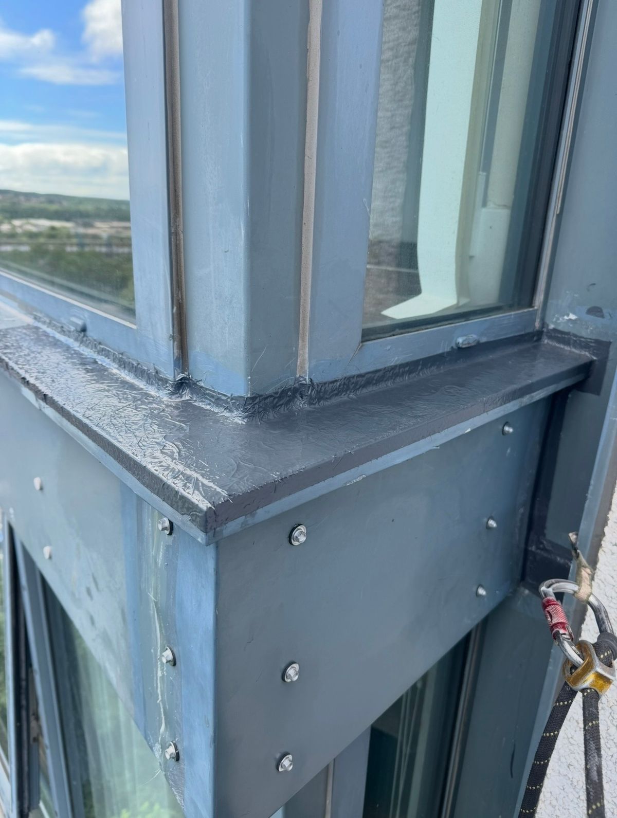 Completed remedial sealing to the window frame and façade junction following rope access water leak investigation on a Newcastle high-rise.