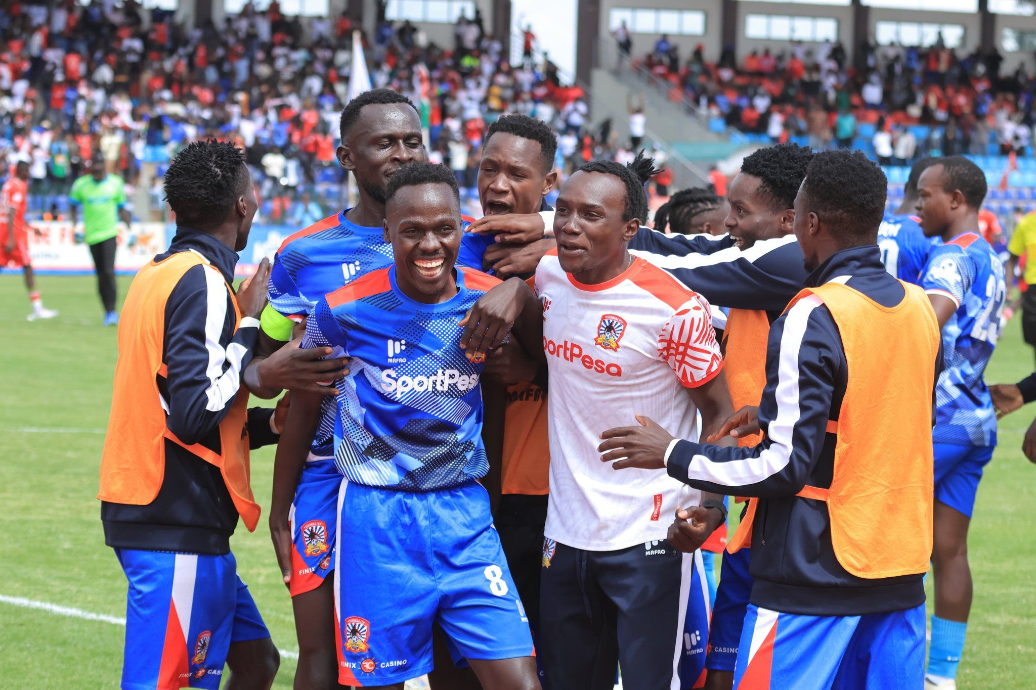 Mark Okola 17' Goal and teammates cheering