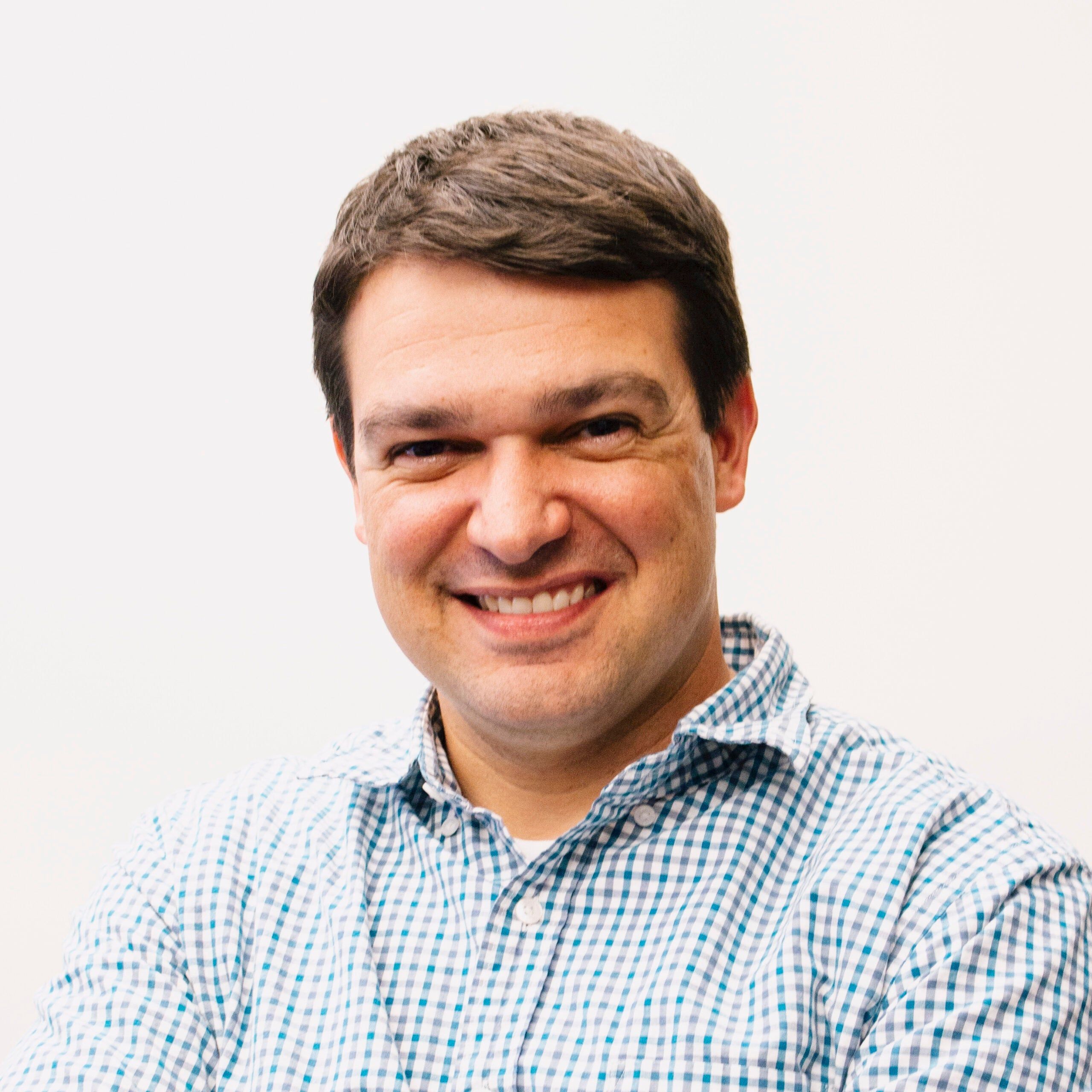 A headshot of TPG's Nick Ewen