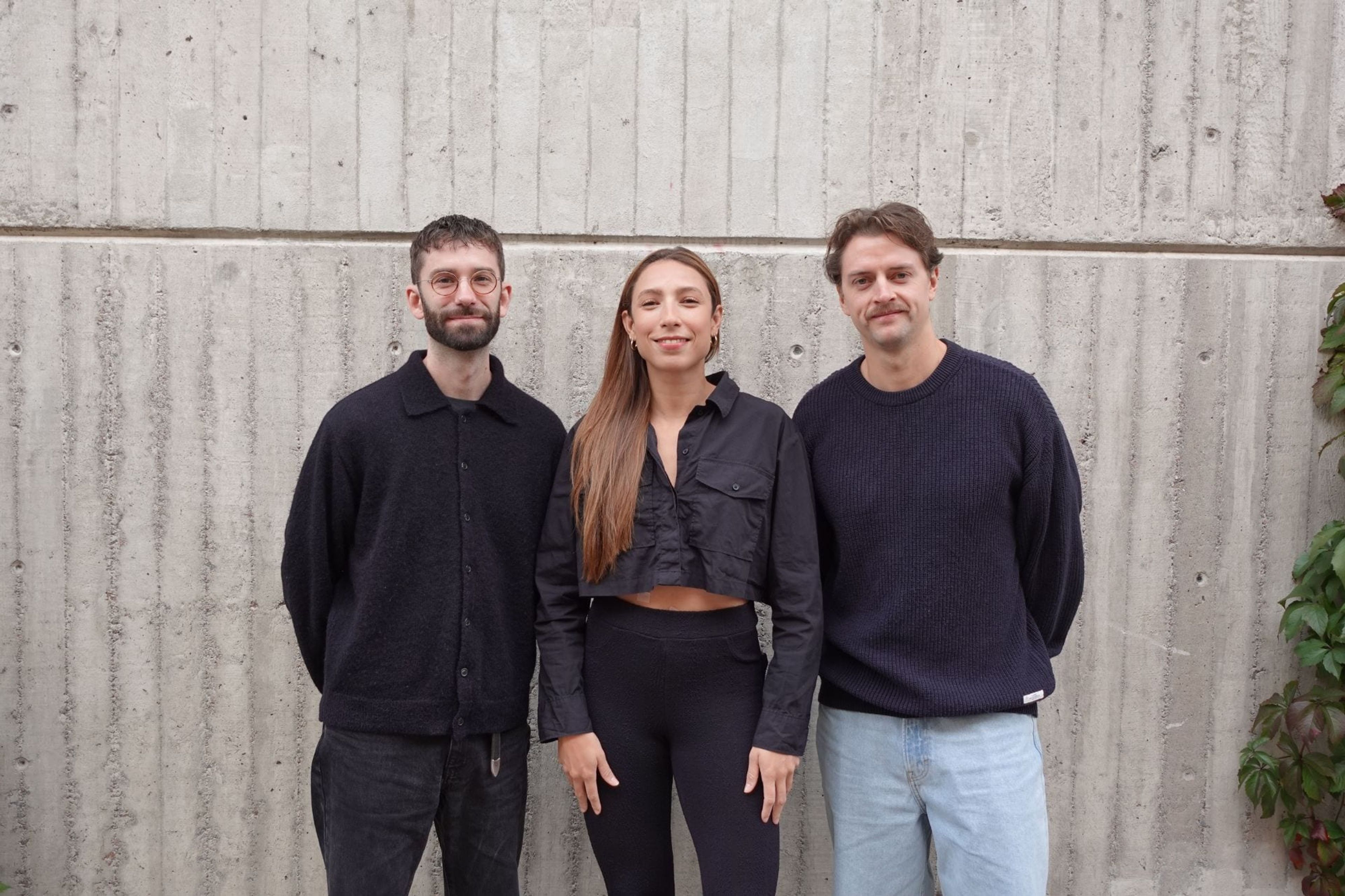 Swirl co-founders Marcus Henningsson, Jade Arana and Emil Hed standing in front of a concrete wall