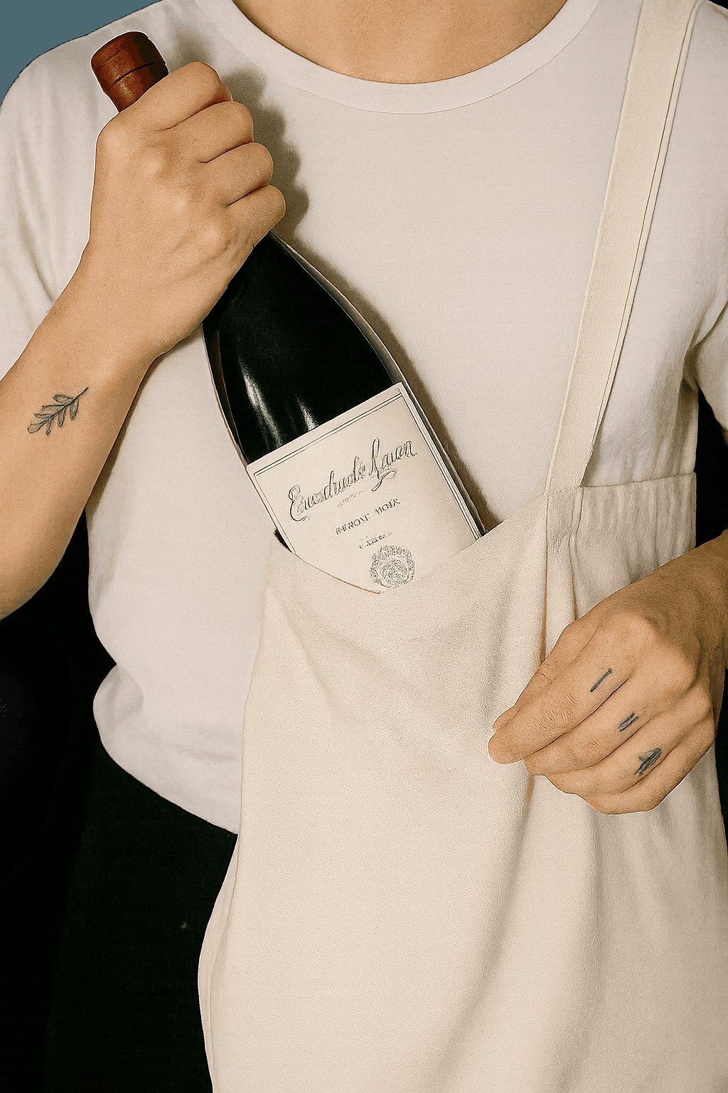 Bottle of red wine sticking out of a canvas tote bag