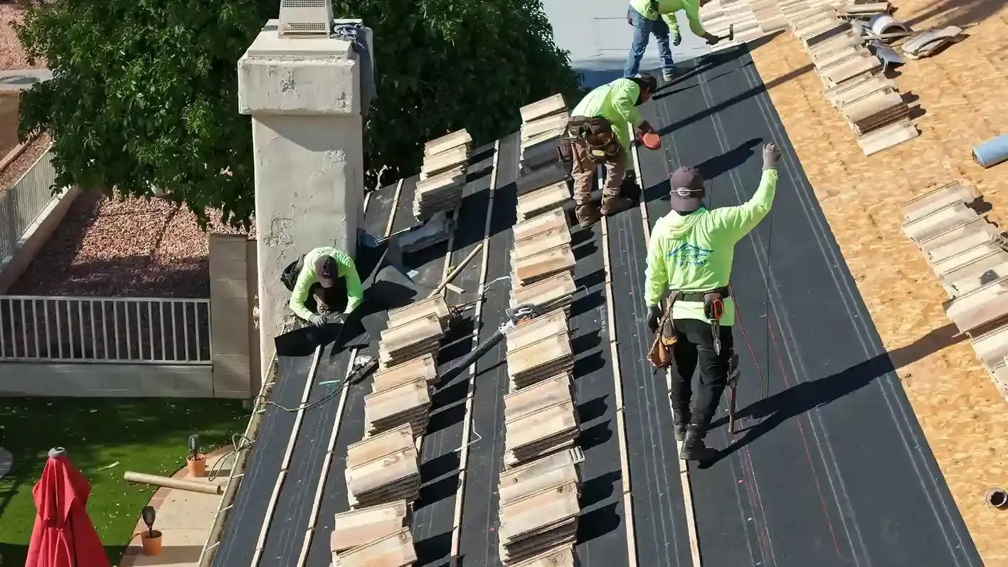 Roofing crew working on a house