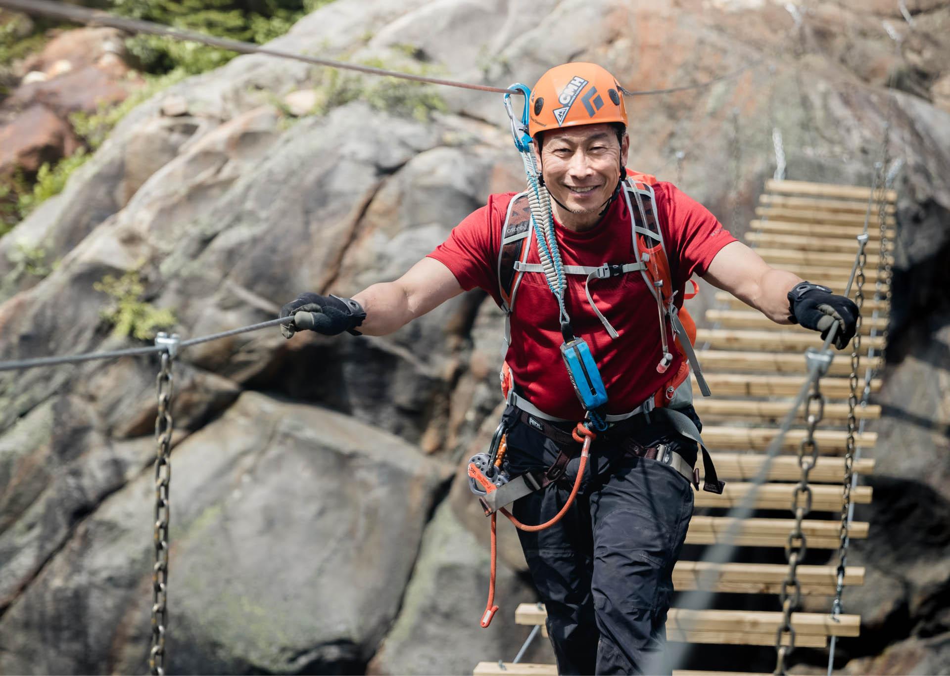 Crossing a suspension bridge on the Mount Nimbus Via Ferrata