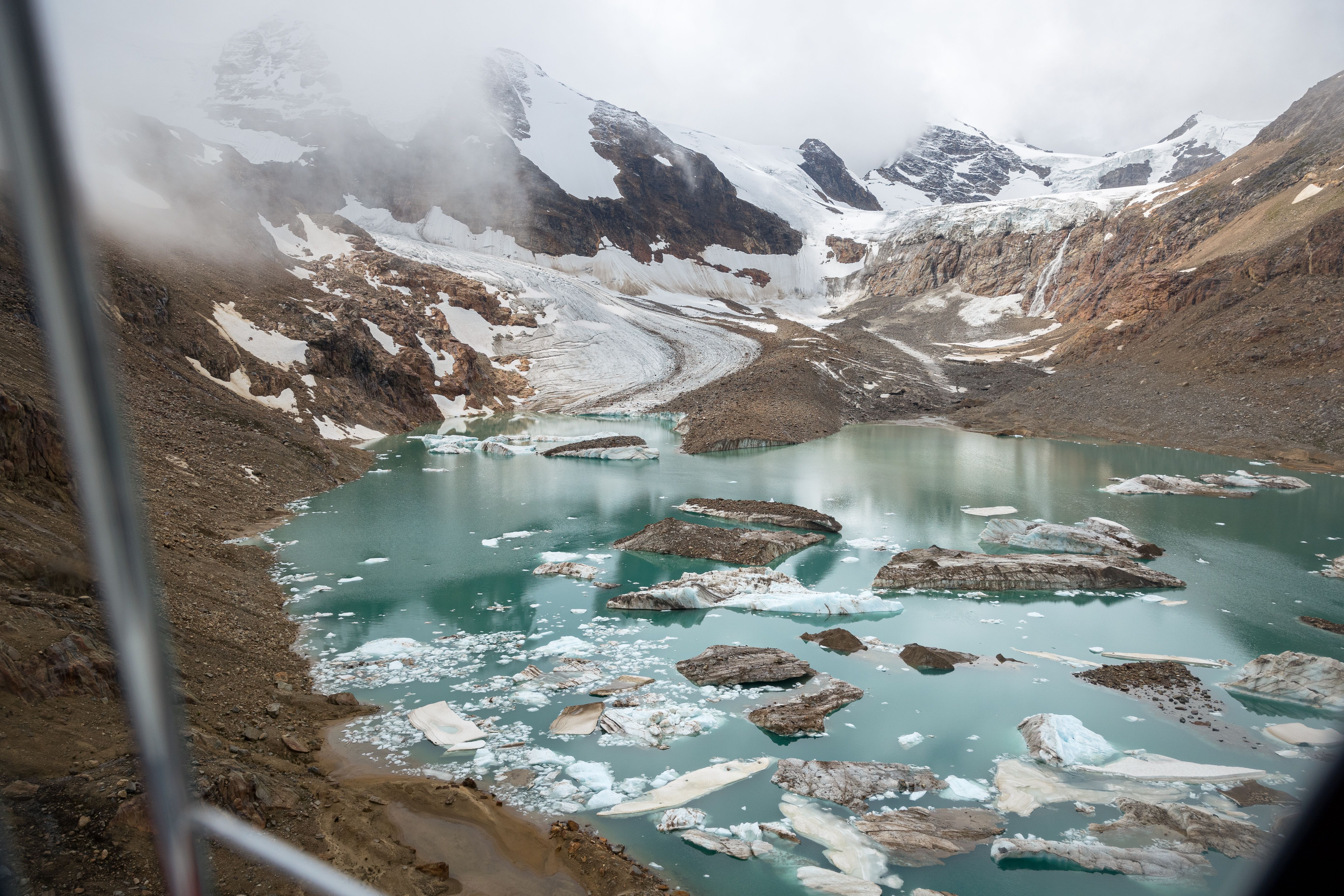 Helicopter view of a glacial pond in the mountains