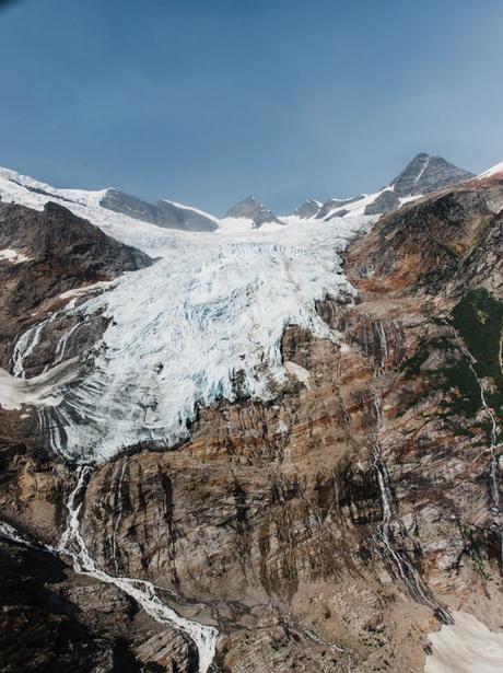 View of a glacier out the window of a helicopter