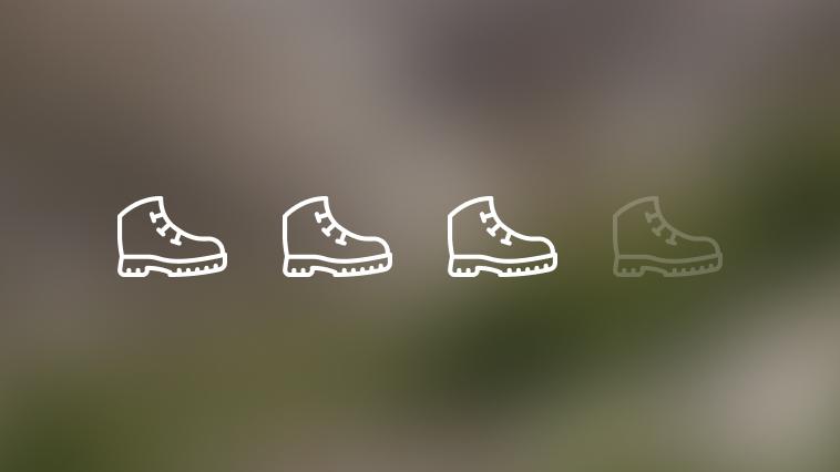 Green blurred background with three hiking boot icons