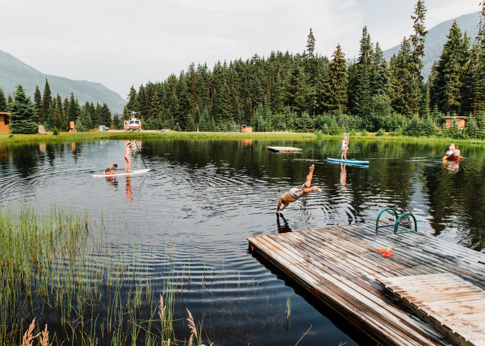 People enjoying a pond