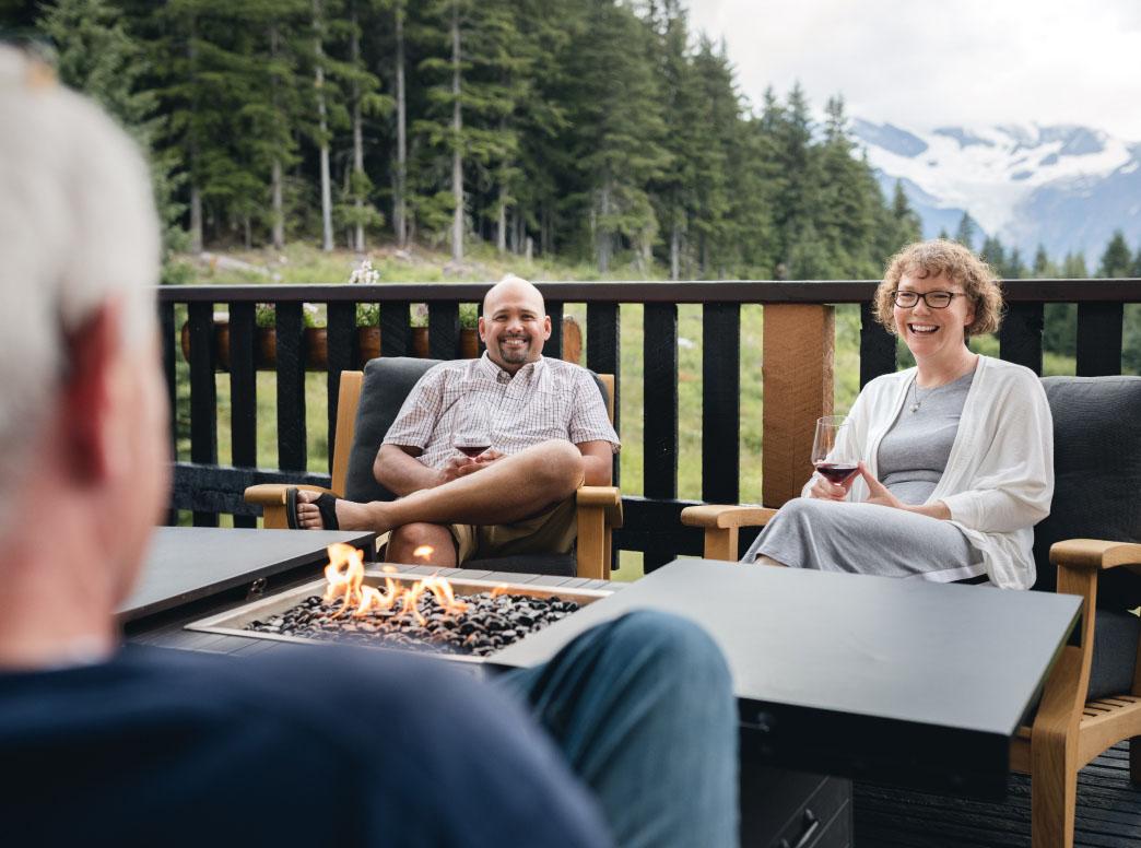 A couple socializing on a lodge patio