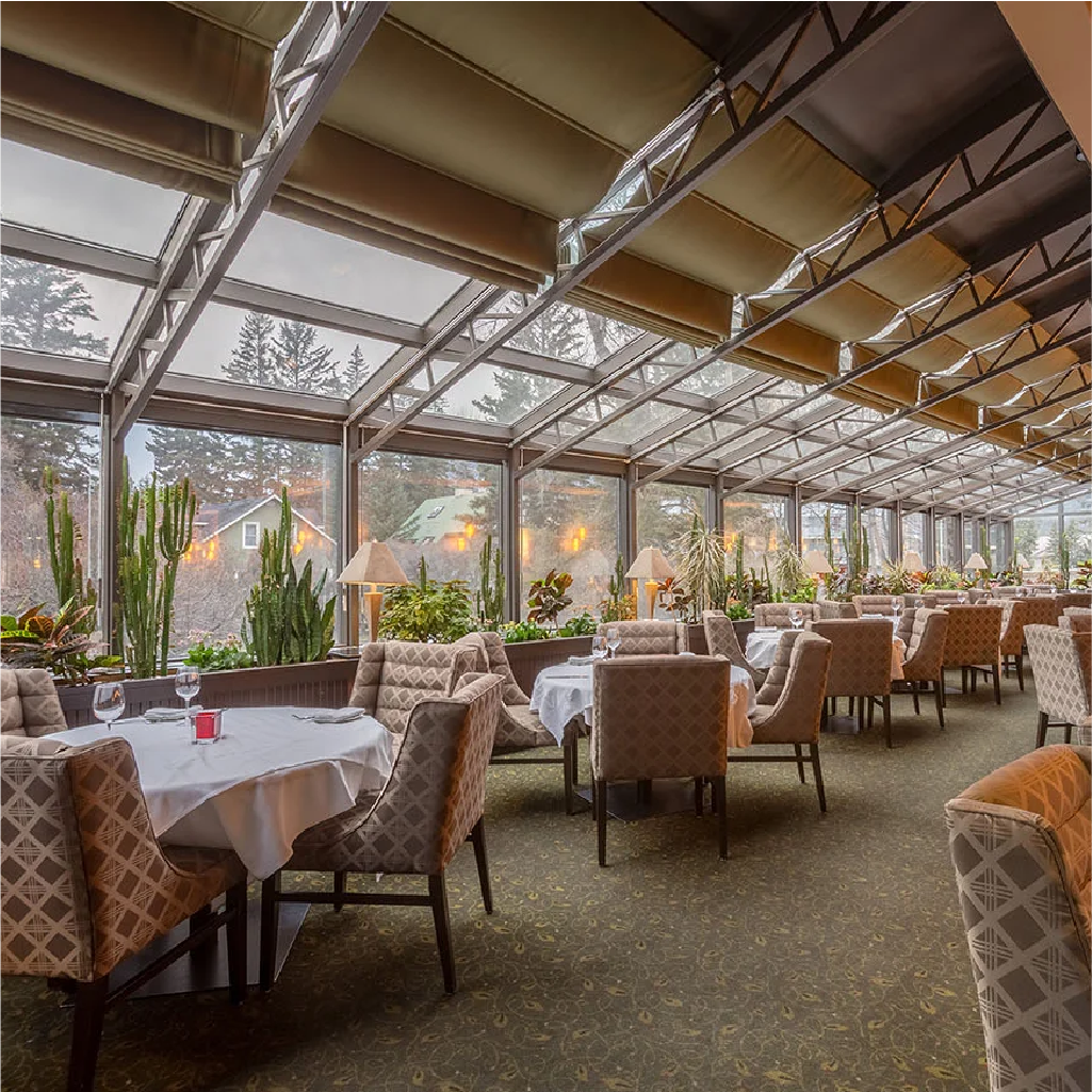 The dining area of the Banff Park Lodge with ample seating and natural light