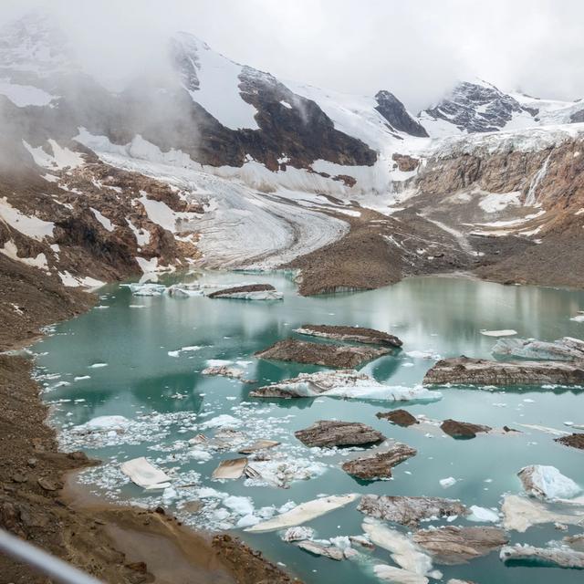 Helicopter view of a glacial pond in the mountains