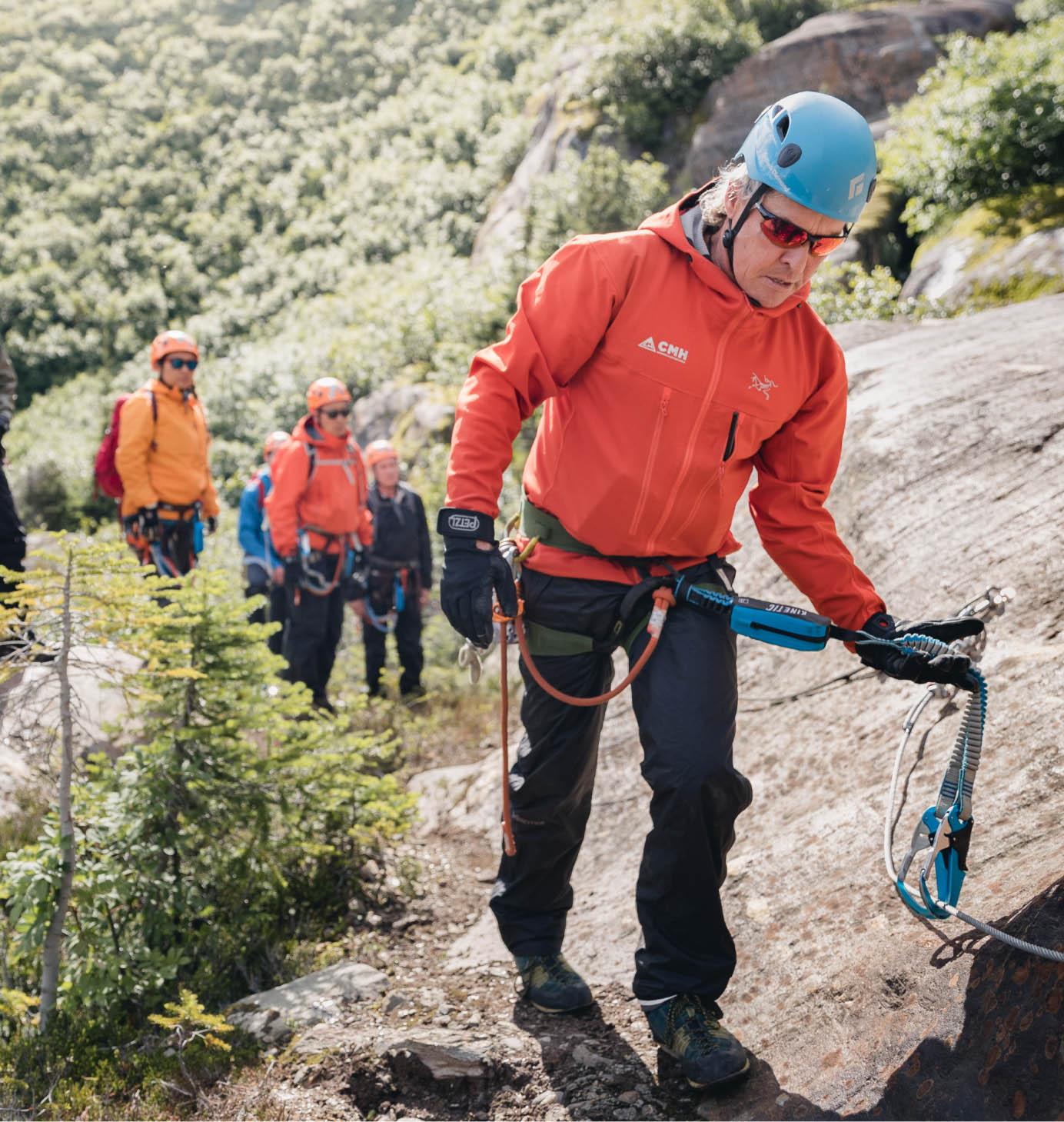 A guide ahead of a group on a via ferrata
