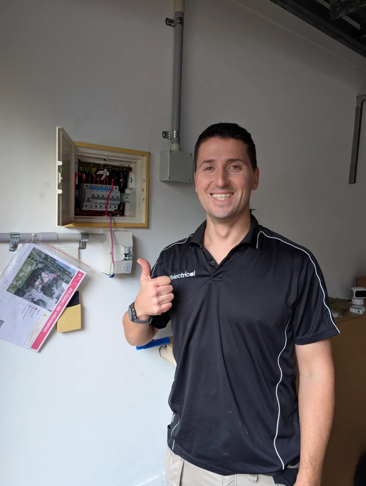Revelectrical electrician at an open switchboard