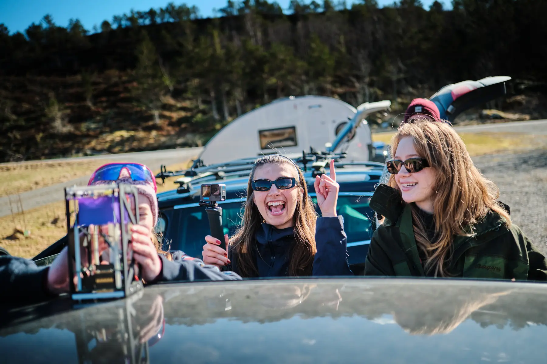 Picture of a three orbiters admiring their Sub-orbital Satellite 