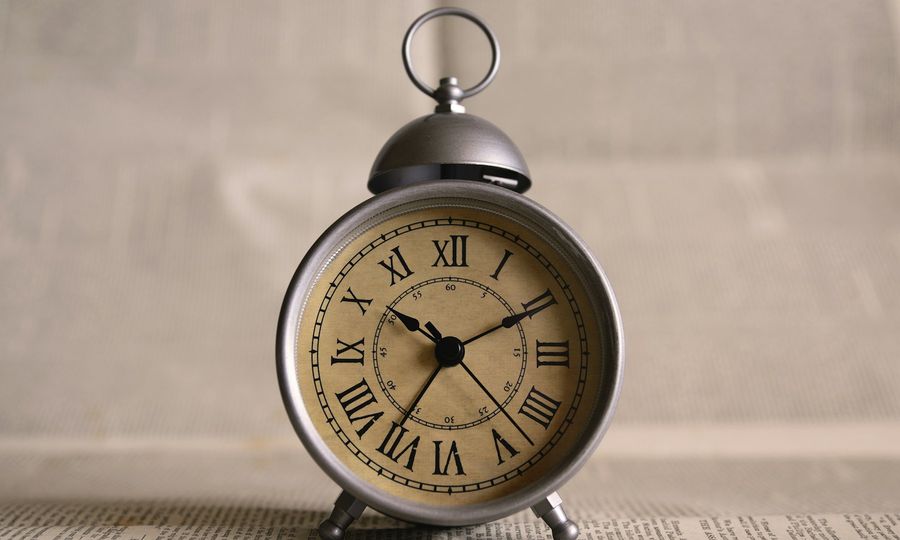 Turned on gray alarm clock displaying 10:11