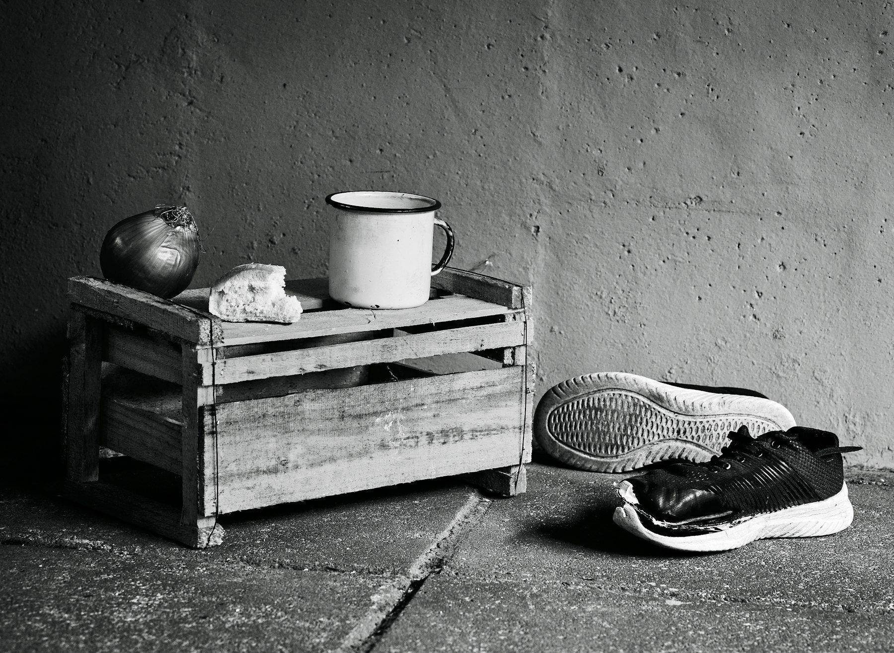 A black and white photo of a pair of shoes