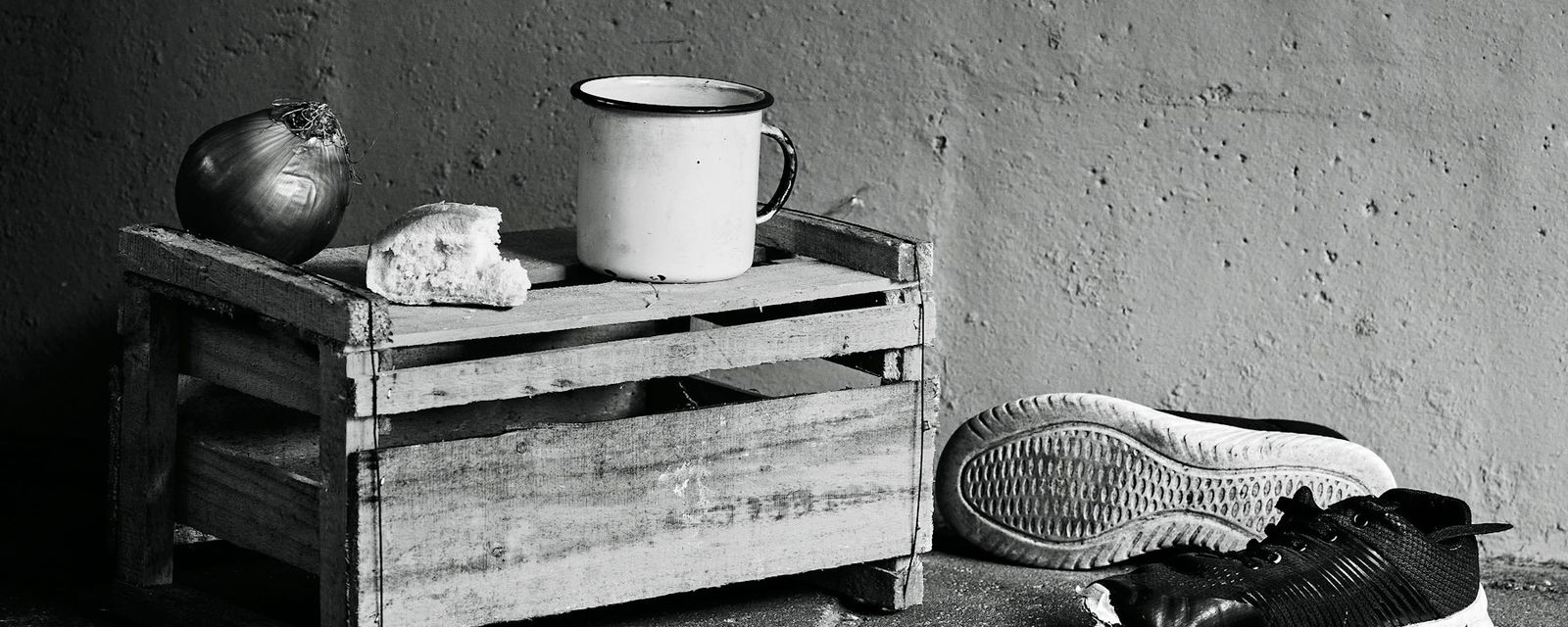 A black and white photo of a pair of shoes