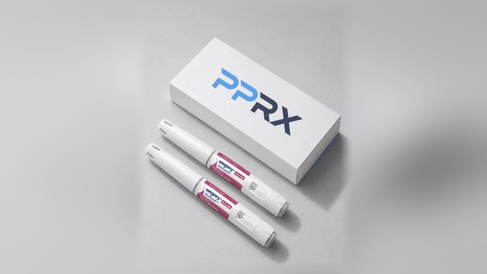 PPRX box with two Wegovy 0.5mg pens on a grey studio background