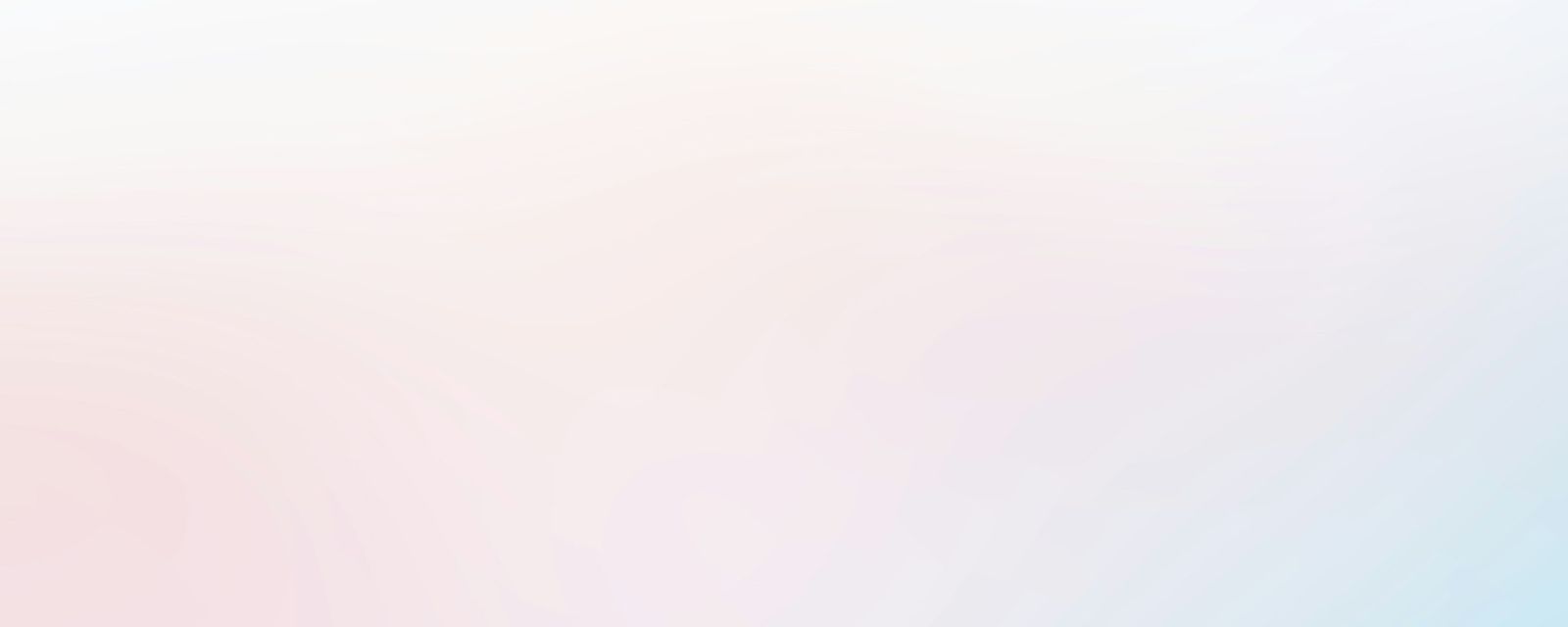 A blurry photo of a pink and blue background