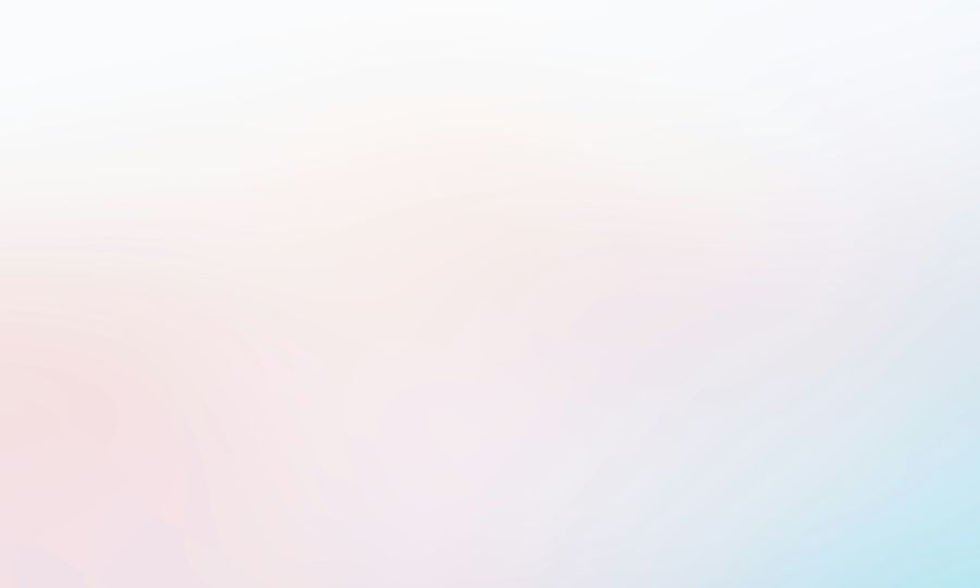 A blurry photo of a pink and blue background