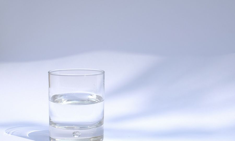 Clear drinking glass filled with water