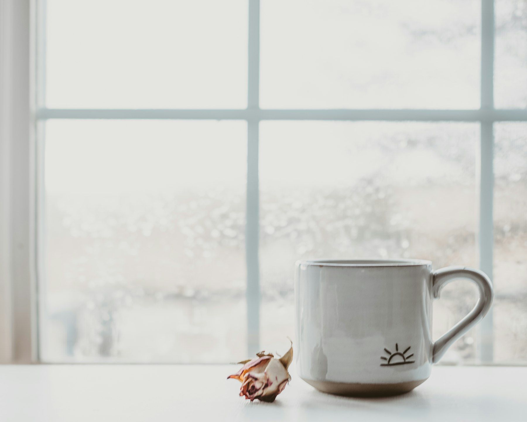 White ceramic mug on white table