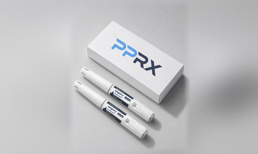 PPRX box with two Wegovy 2.4mg pens on a grey studio background