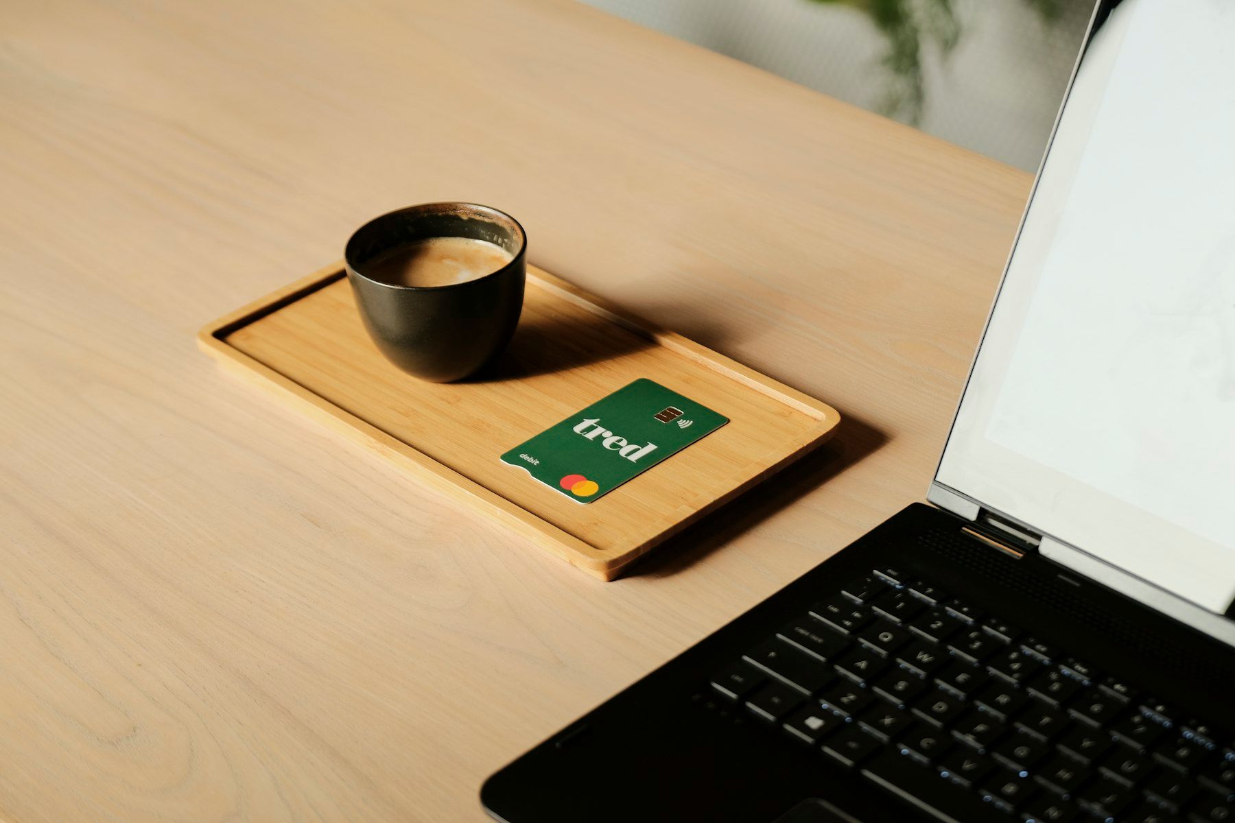 A laptop computer sitting on top of a wooden desk