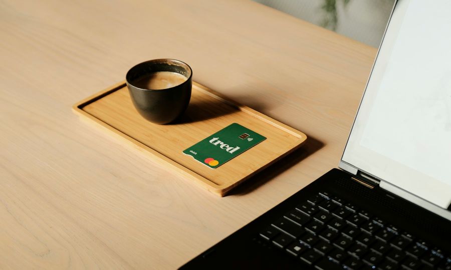 A laptop computer sitting on top of a wooden desk