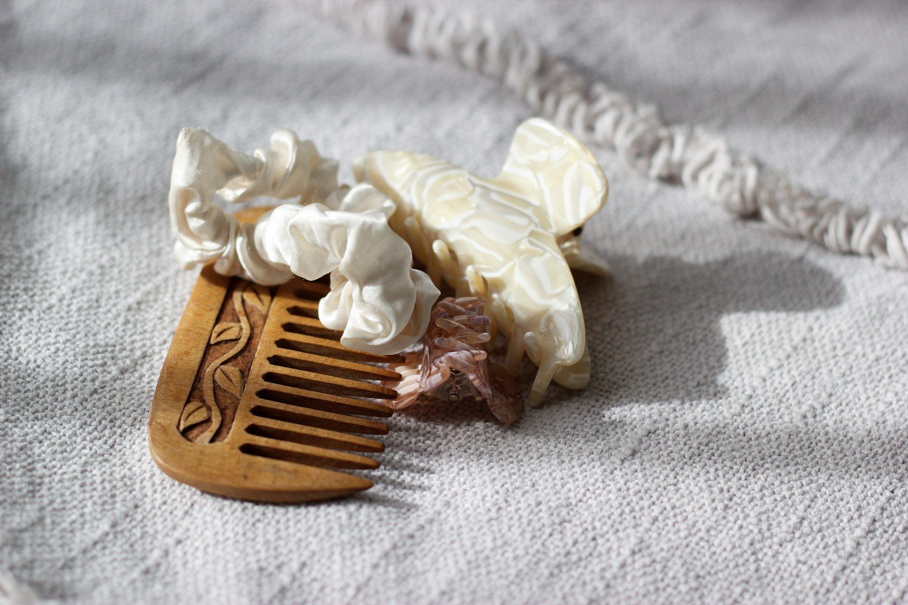 Wooden comb with decorative hair clips and scrunchies