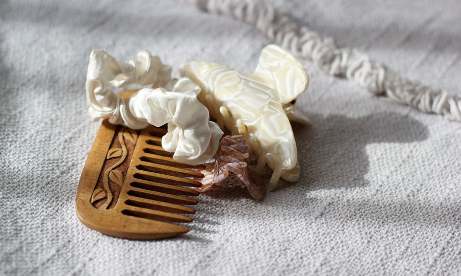 Wooden comb with decorative hair clips and scrunchies