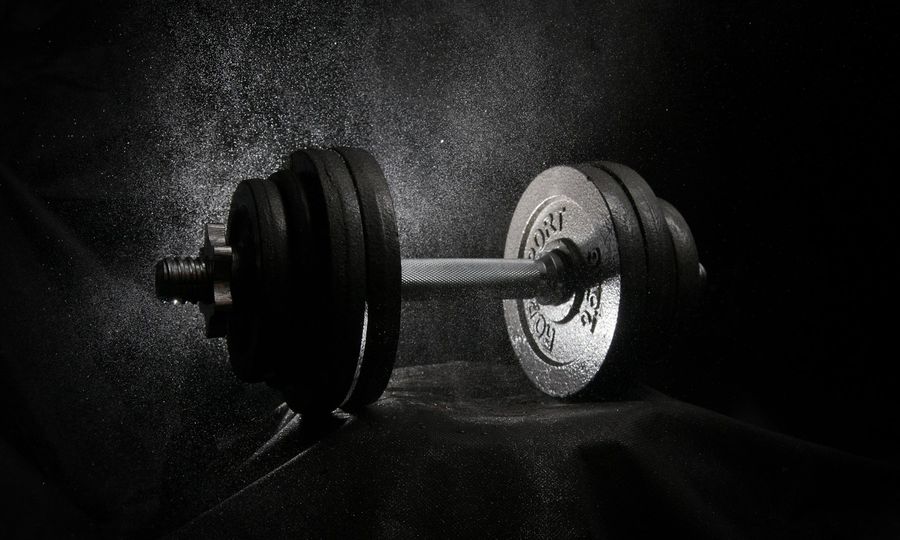 A black and white photo of a dumbbell