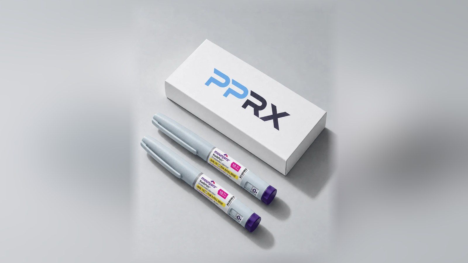 PPRX box with two Mounjaro 10mg pens on a grey studio background