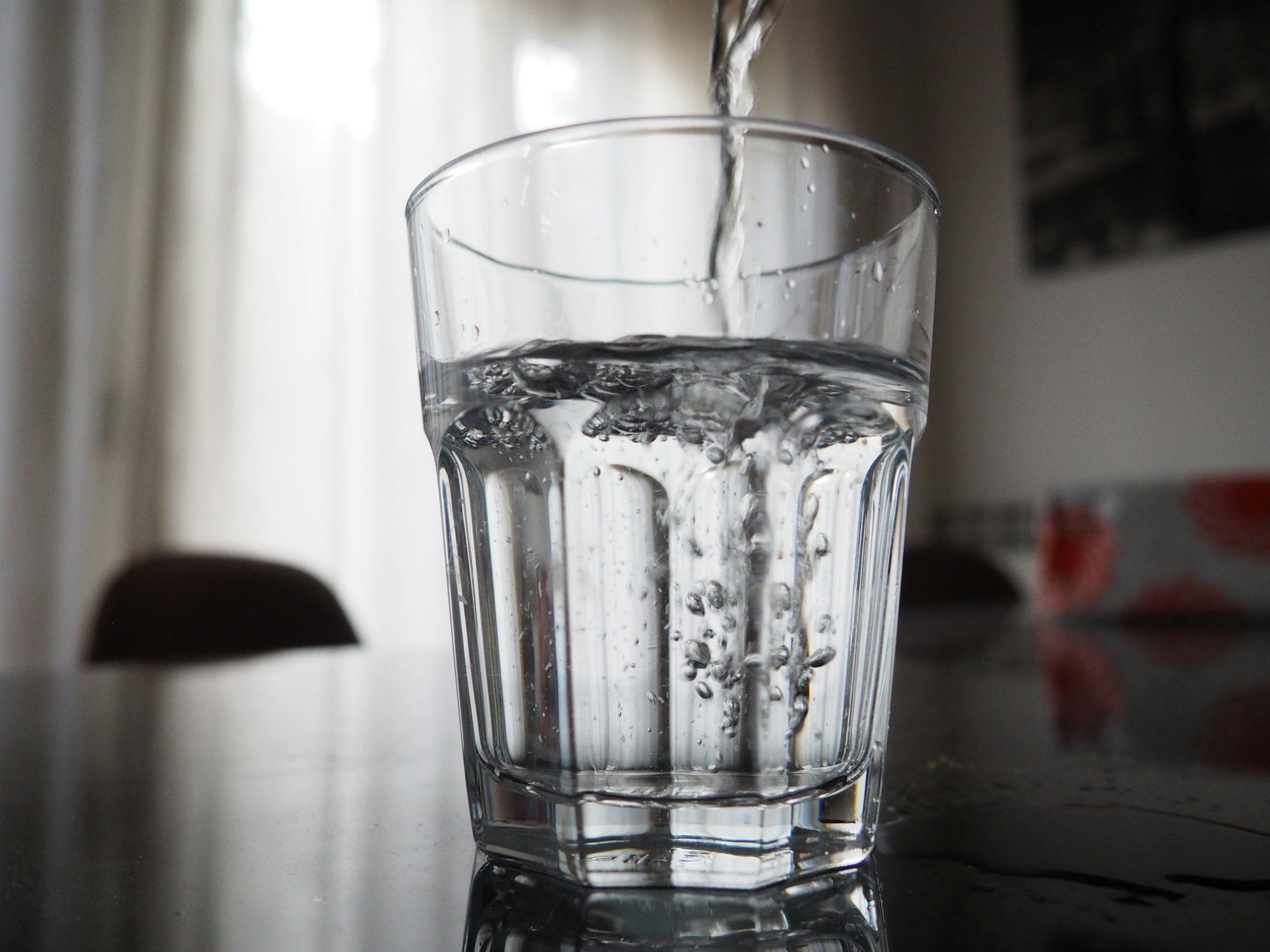 Water is being poured into a glass