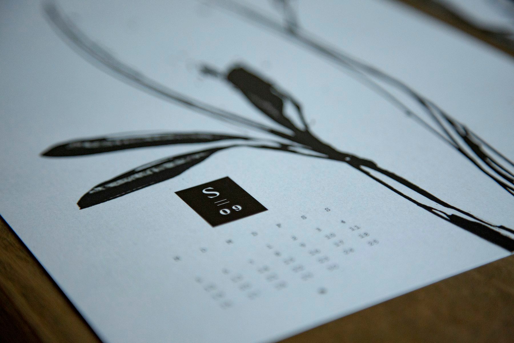 Black usb cable on white paper