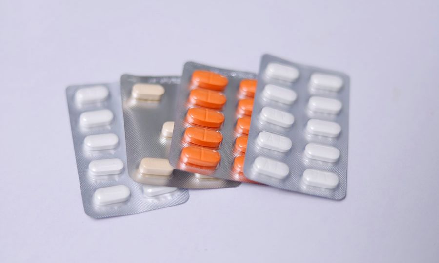 A couple of pills sitting next to each other