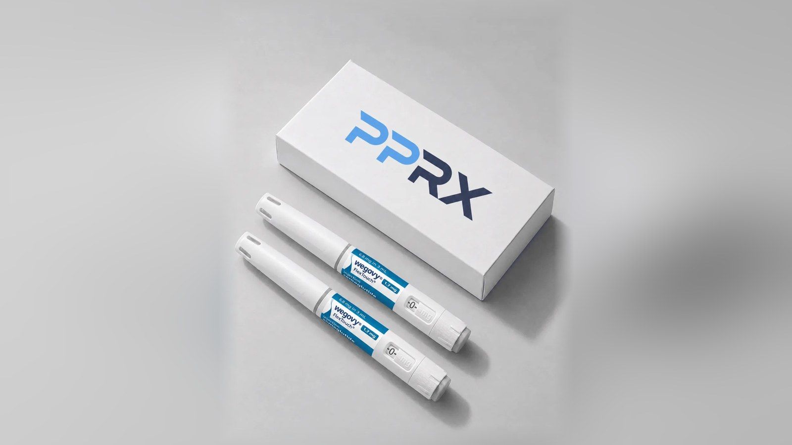 PPRX box with two Wegovy 1.7mg pens on a grey studio background