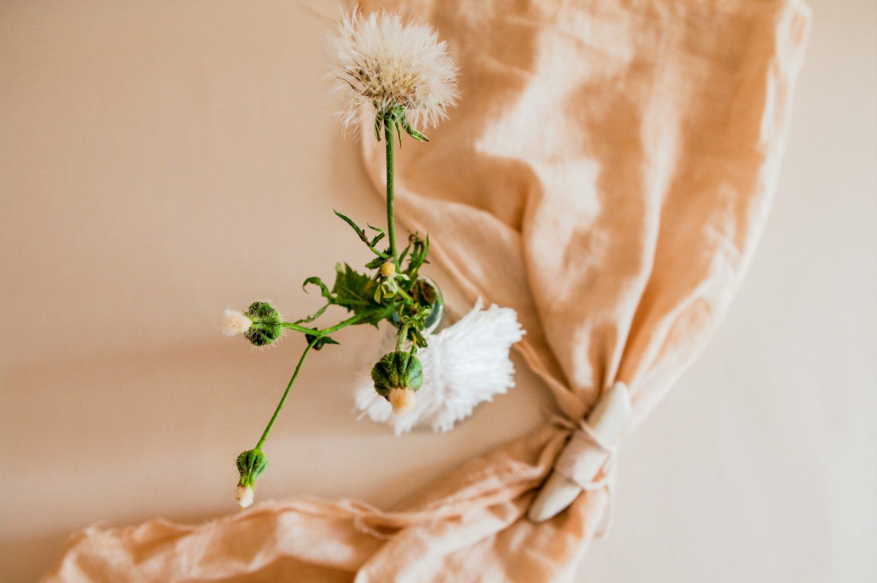 White flower on orange textile