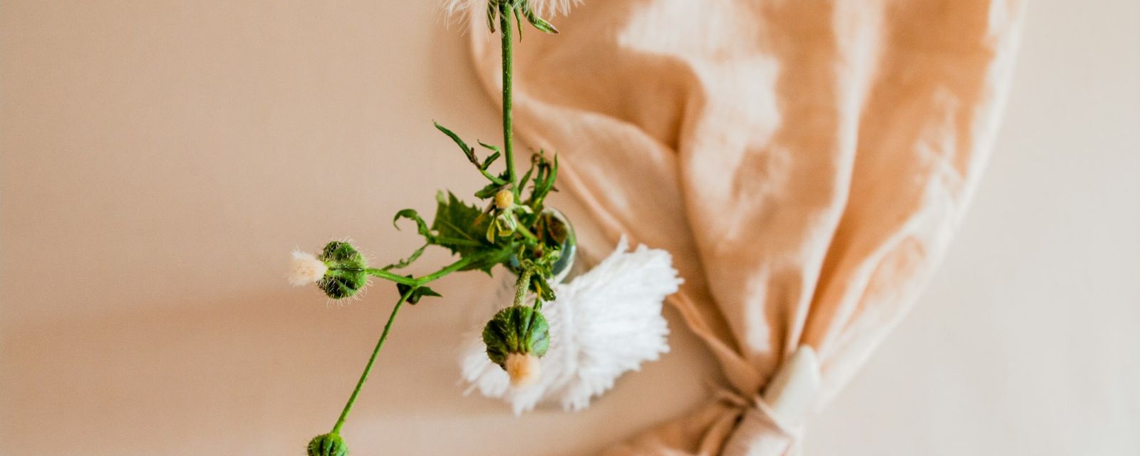 White flower on orange textile