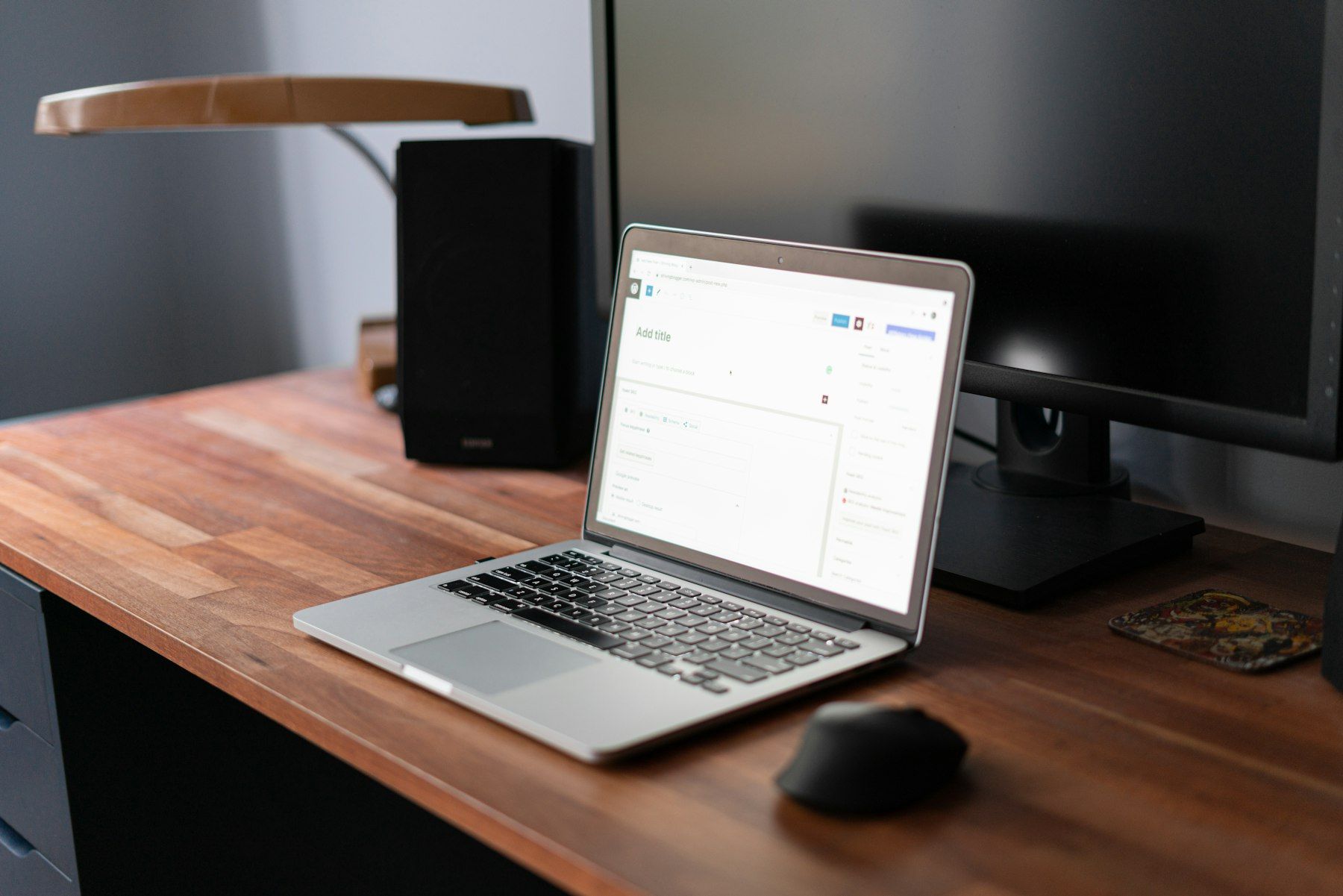 Macbook pro on brown wooden table