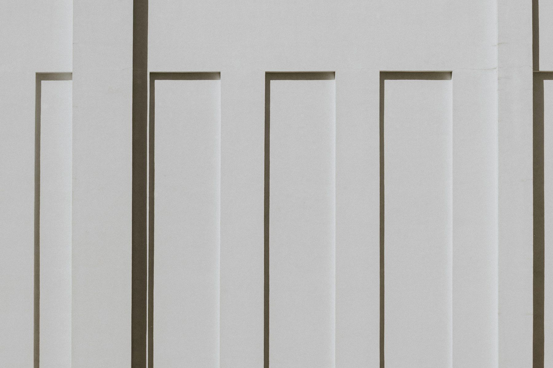 White vertical panels with strong shadows